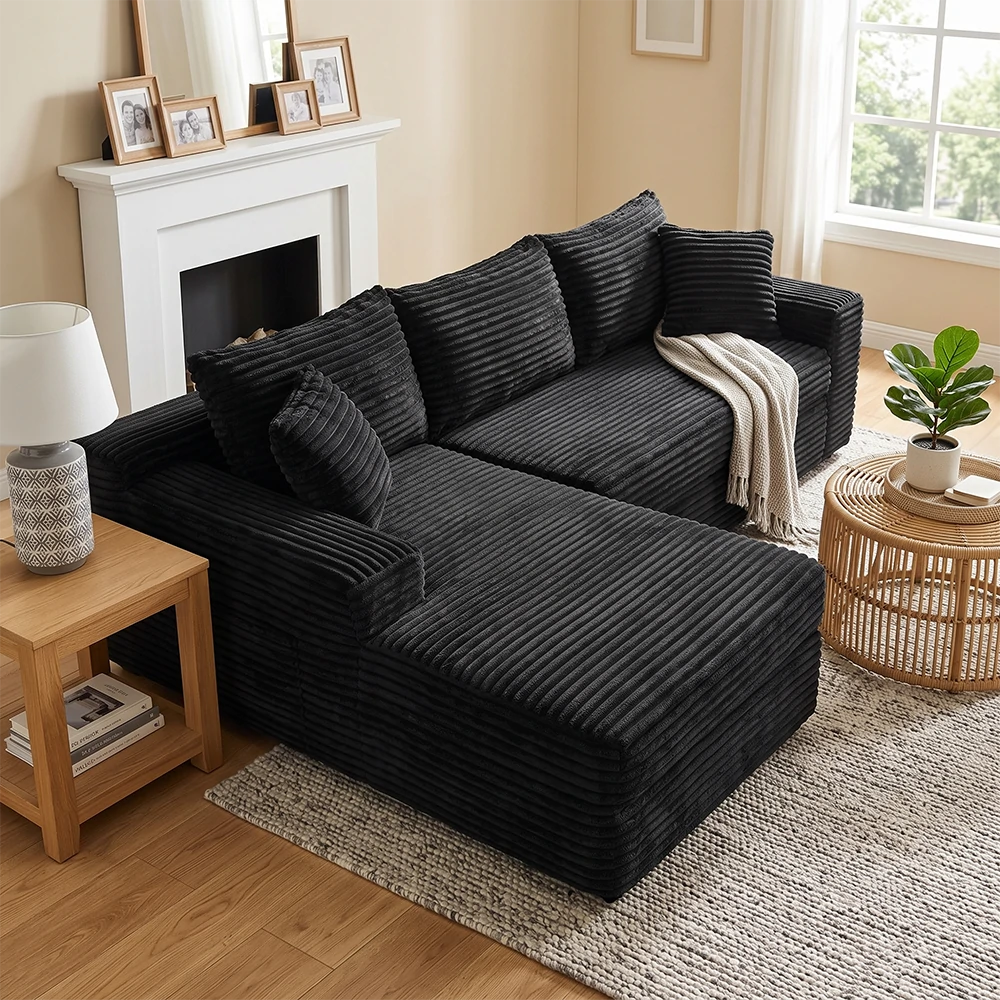Black corduroy L shaped sectional sofa in cozy living room
