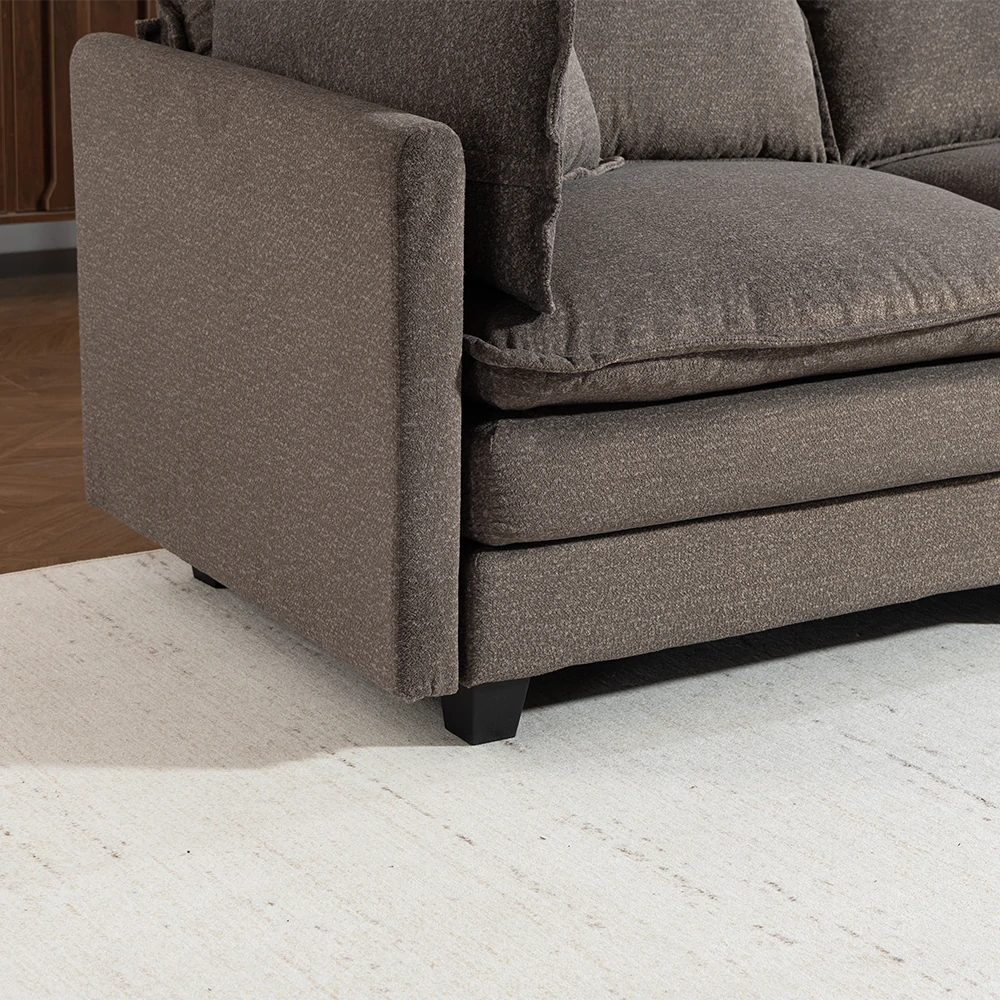 Close up of armrest and bottom cushion of grey sofa