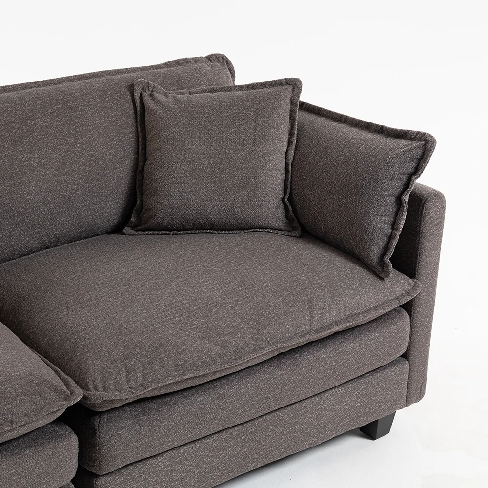 Close up of deep seat cushion and pillow on grey sofa