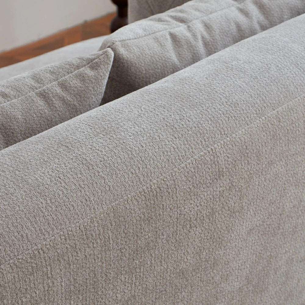 Close up of durable textured fabric and stitching on grey sofa