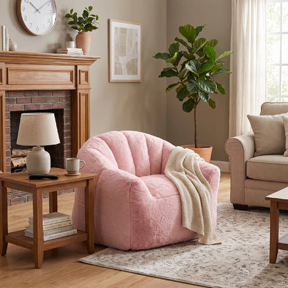 Cozy pink faux fur lounge chair in living room