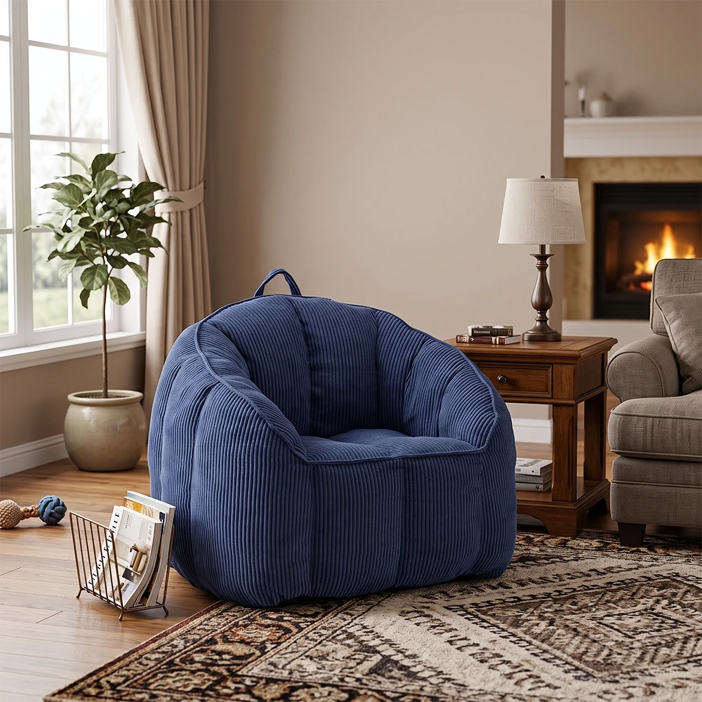 Dark blue corduroy bean bag chair with handle in living room
