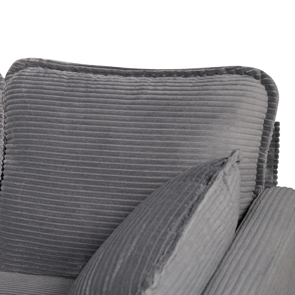 Detail of piped edge on grey corduroy sofa back cushion