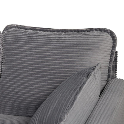 Detail of piped edge on grey corduroy sofa back cushion