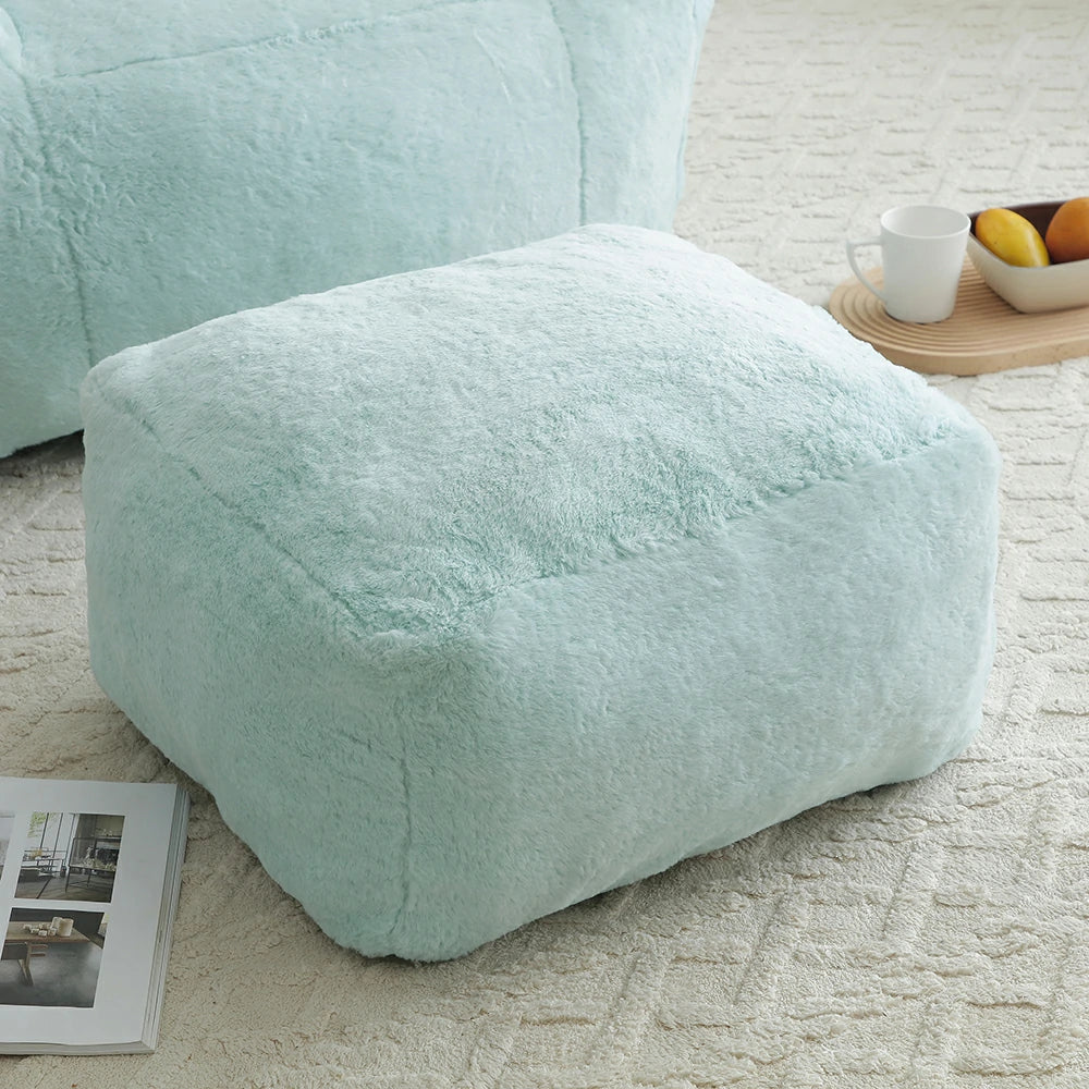 Fluffy light blue faux fur ottoman footstool detail