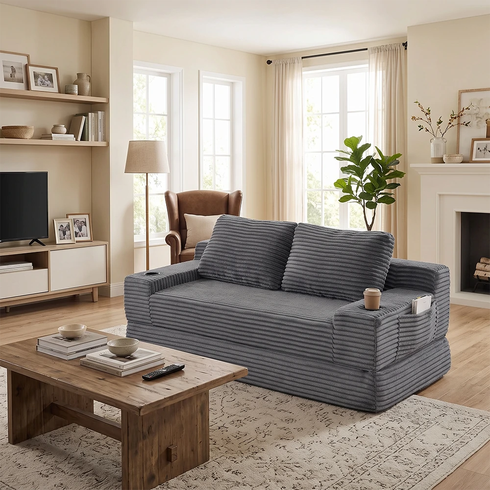 Modern dark grey corduroy convertible sleeper sofa with cup holders in a warm contemporary living room