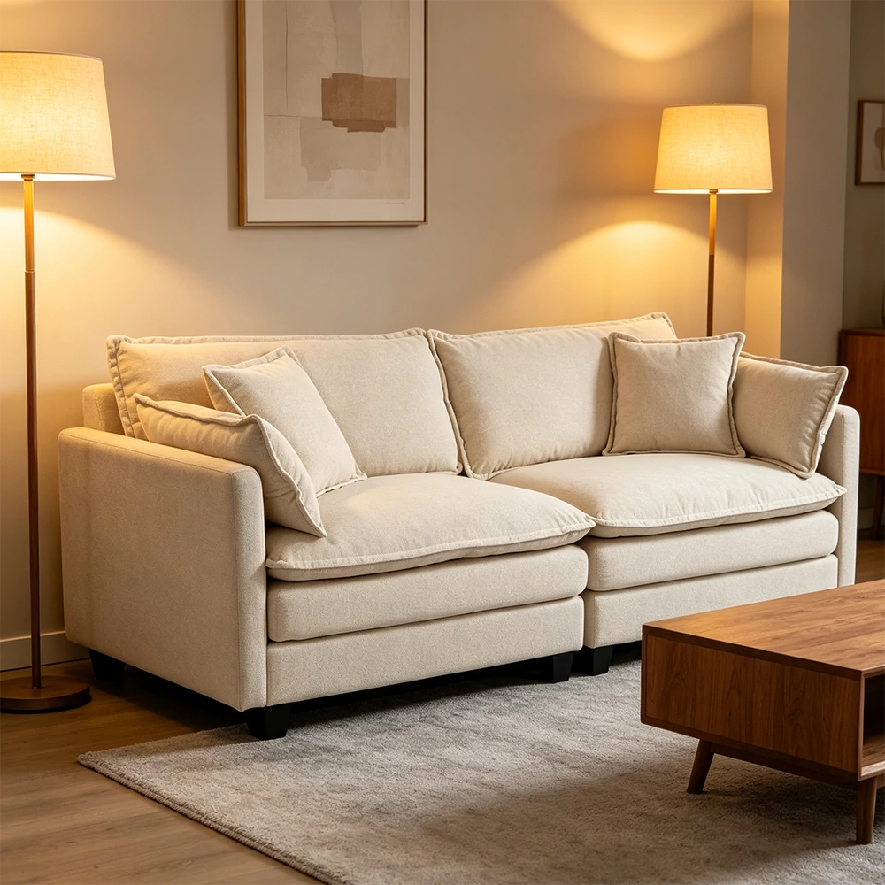 Modern white fabric sofa in warm lit living room