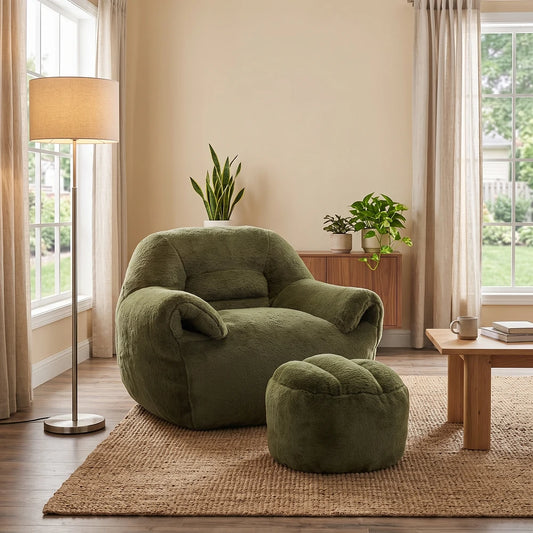 Plush green armchair with matching ottoman in a modern living room