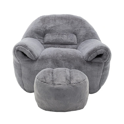 Plush grey armchair and matching ottoman front view