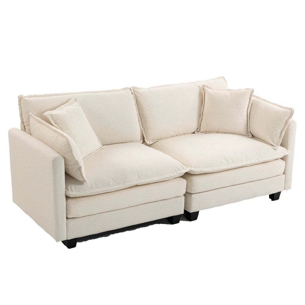 Side angle of plush white sofa with cushions