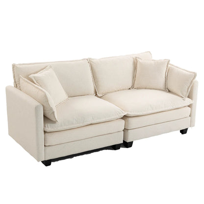 Side angle of plush white sofa with cushions
