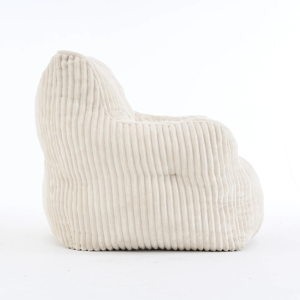 Side view beige ribbed corduroy lounge chair