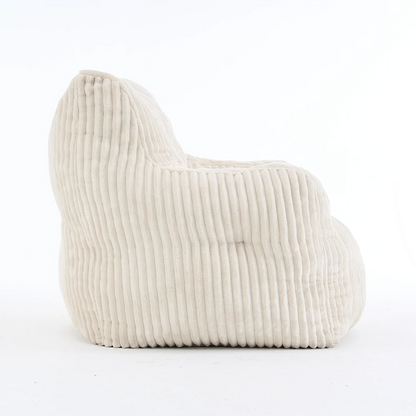Side view beige ribbed corduroy lounge chair