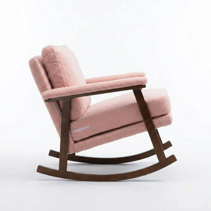 Side view of pink bouclé rocking chair with solid wood frame