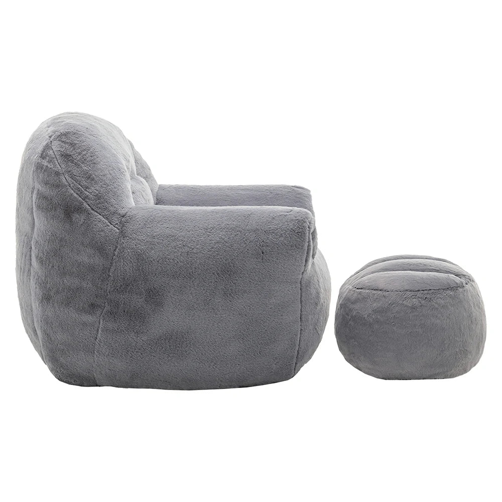 Side view of plush grey armchair with ottoman