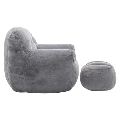 Side view of plush grey armchair with ottoman