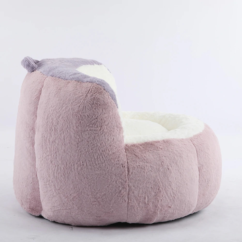 Side view of plush pink bean bag armchair