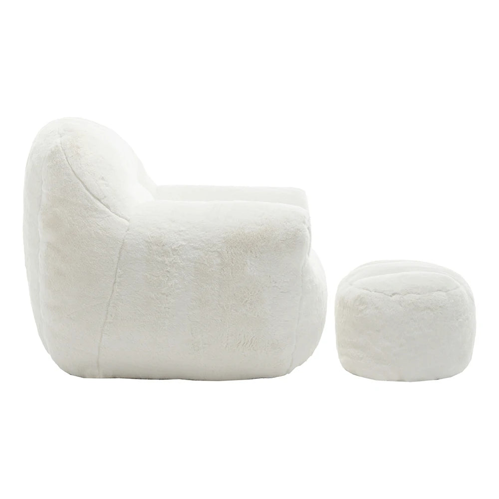 Side view of plush white armchair with ottoman