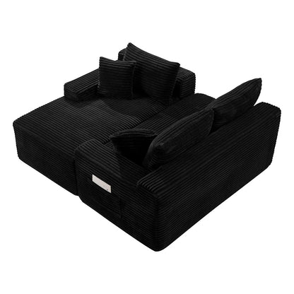 Top view of black corduroy L shaped sofa with pillows