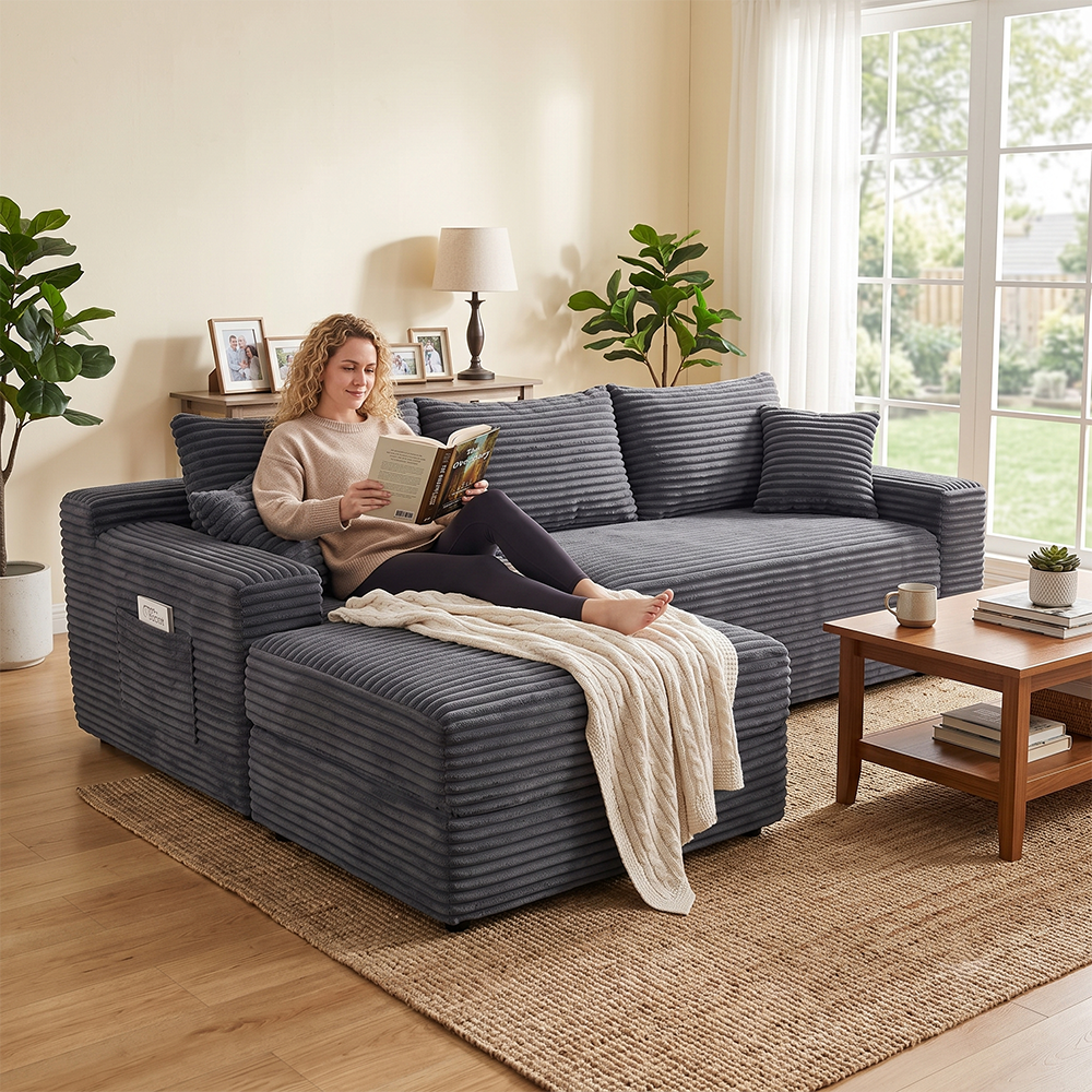 Woman reading a book on grey corduroy sectional sofa