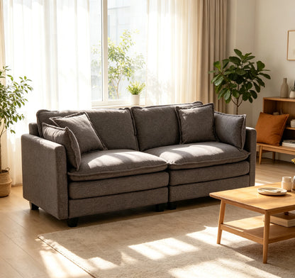 grey fabric couch in sunlit living room