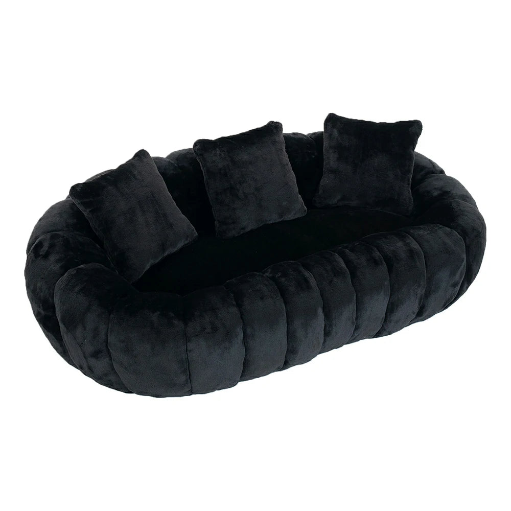 top angle of black plush faux fur loveseat sofa with pillows